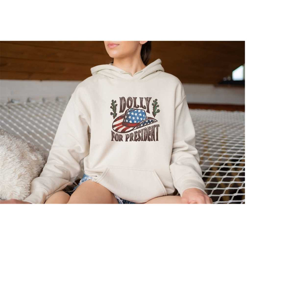 MR-10102023105730-dolly-2024-hoodie-dolly-for-president-funny-election-hoodie-image-1.jpg