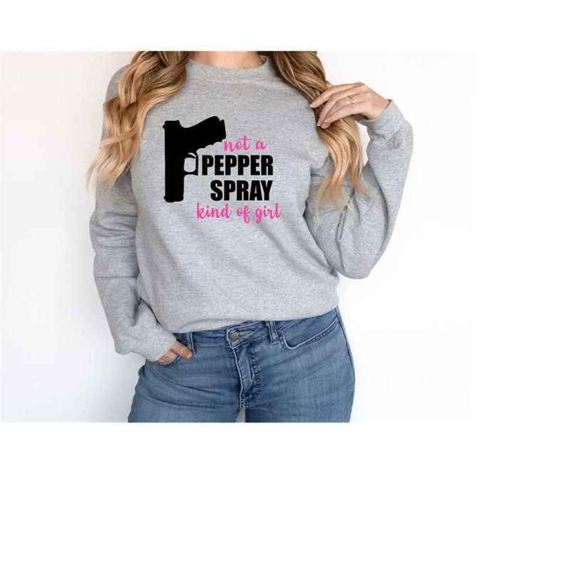 MR-10102023173117-not-a-pepper-spray-kind-of-girl-sweatshirt-funny-women-image-1.jpg