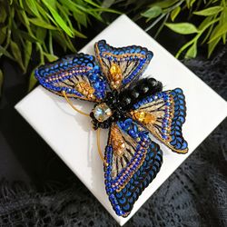 Brooch-pin made of beads and Swarovski crystals in the form of an embroidered Butterfly