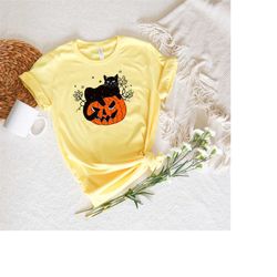 black cat on pumpkin shirt, shirt for fall, black cat t-shirt, halloween black cat design, halloween gifts for cat owner