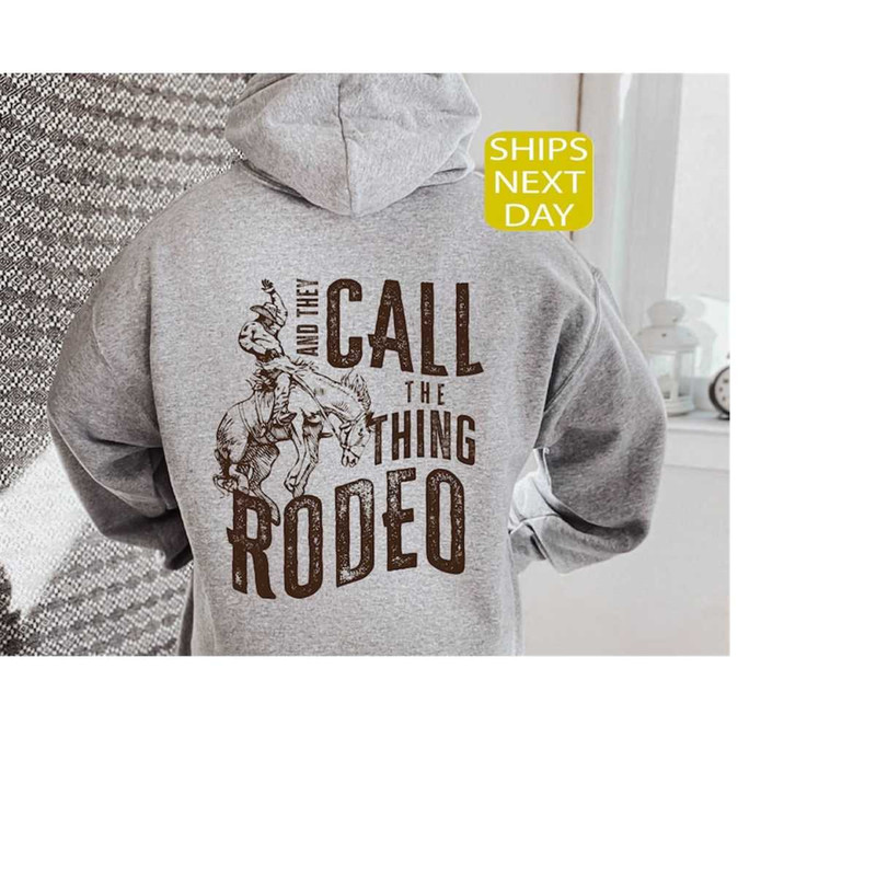 MR-12102023101643-and-they-call-the-thing-rodeo-hoodie-rodeo-hoodie-trendy-image-1.jpg
