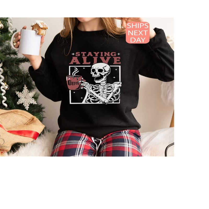 MR-12102023175954-staying-alive-sweatshirt-coffee-lovers-funny-skeleton-image-1.jpg