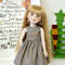 A 15-inch Ruby Red Fashion Friends doll in a Harry Potter-style dress