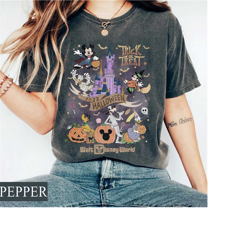 MR-1710202314377-retro-disney-halloween-2023-trick-or-treat-comfort-colors-tee-image-1.jpg