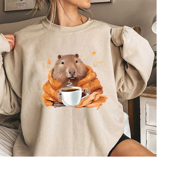 MR-17102023185537-capybara-in-a-cozy-blanket-chilling-and-drinking-shirt-image-1.jpg