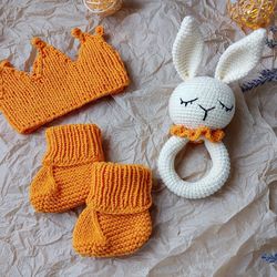 Gift box for baby set orange rodents bunny, crown, booties. Christening or expecting a baby. Gift set for a newborn baby