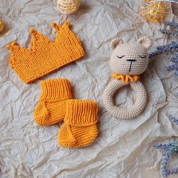 Gift box for baby set orange rodents bear, crown, booties. Christening or expecting a baby. Gift set for a newborn baby