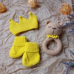 Gift box for baby set yellow rodents bear, crown, booties. Christening or expecting a baby. Gift set for a newborn baby