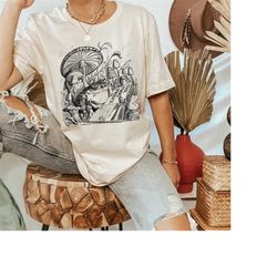 frog reading book under mushroom shirt, cute cottagecore frog shirt, book lover shirt, reading book shirt