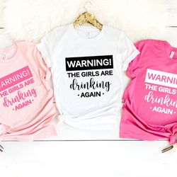 warning the girls are drinking again shirt png, drinking buddies, friends shirt png, day drinking shirt png, best frien