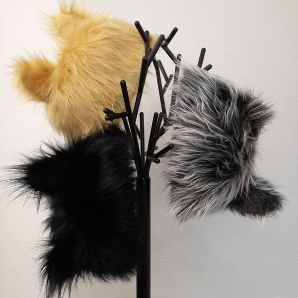 A hat with ears and a mane made of faux fur. Costume of a wolf, cat, lioness, panther, husky for a festival, cosplay.