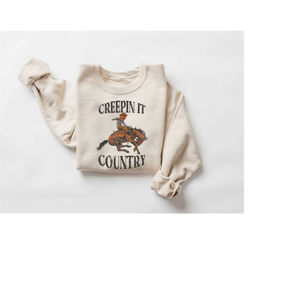 MR-24102023113151-creeping-it-country-sweatshirt-western-halloween-skeleton-image-1.jpg