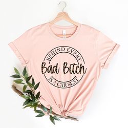 behind every bad bitch is a car seat shirt png, bad bitch shirt png, sarcastic woman shirt png, funny woman shirt pngs,