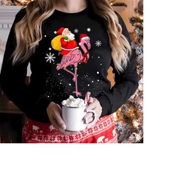 santa claus riding pink flamingo t-shirt,flamingo christmas shirt,flamingo christmas sweatshirt, christmas pink flamingo