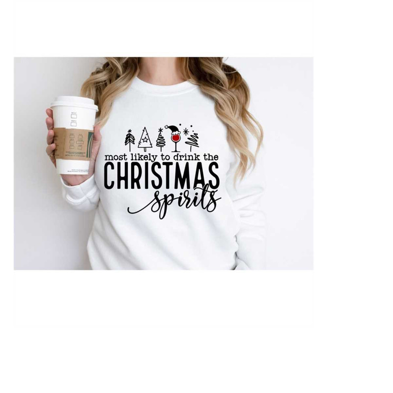 MR-31102023142659-christmas-spirit-sweatshirt-most-likely-to-drink-christmas-image-1.jpg