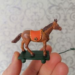 Horse on a gurney for a dollhouse.