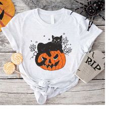 black cat on pumpkin t shirt, shirt for fall, black cat shirt, halloween black cat design, halloween gifts for cat owner