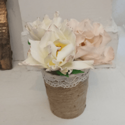 Delicate small bouquet in a jute pot