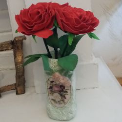 Luxurious red roses in a handmade vase