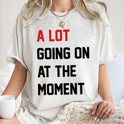 a lot going on at the moment, eras tour outfit, concert merch, not new eras xpression