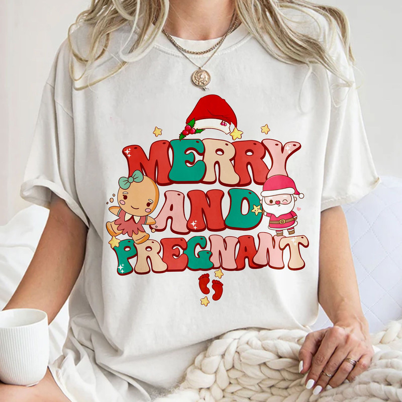 Merry and Pregnant Shirt, Funny Pregnancy Reveal Shirt, Christmas Pregnancy Announcement, Baby Reveal Gift Unisex T Shirt Sweatshirt Hoodie 1.jpg