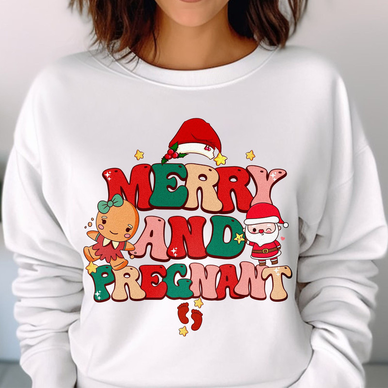 Merry and Pregnant Shirt, Funny Pregnancy Reveal Shirt, Christmas Pregnancy Announcement, Baby Reveal Gift Unisex T Shirt Sweatshirt Hoodie 2.jpg