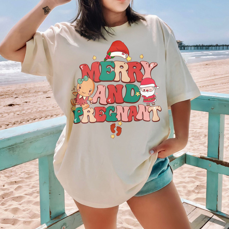 Merry and Pregnant Shirt, Funny Pregnancy Reveal Shirt, Christmas Pregnancy Announcement, Baby Reveal Gift Unisex T Shirt Sweatshirt Hoodie 5.jpg