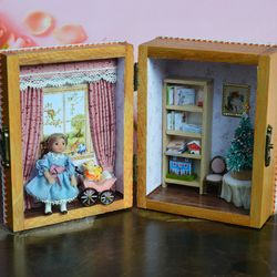 Miniature doll  in 24th scale. Tiny doll with accessories in a wooden casket  at a scale of 1:24.