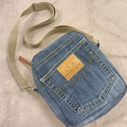 Blue denim bag in the form of a backpack, handmade from completely recycled jeans, crossbody or shoulder bag