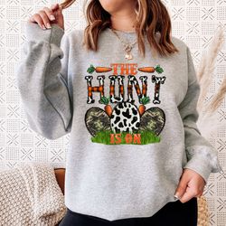 the hunt is on sweatshirt, easter holiday sweatshirt, easter egg hunt sweatshirt, carrot and eggs sweatshirt for easter,
