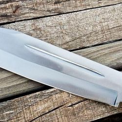 A 17-inch hunting knife with a leather handle and sheath, handmade from D2 steel.