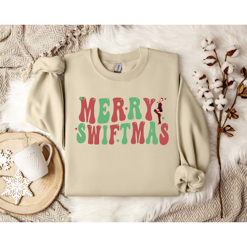 Taylor Swiftie Christmas Sweater, Merry Swiftmas Sweatshirt, Holiday Jumper, Christmas Music Lover Gift, Festive Winter Apparel.jpg