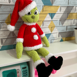 Handmade crochet green Christmas Grinch plush toy. Perfect for holiday decor and gifting