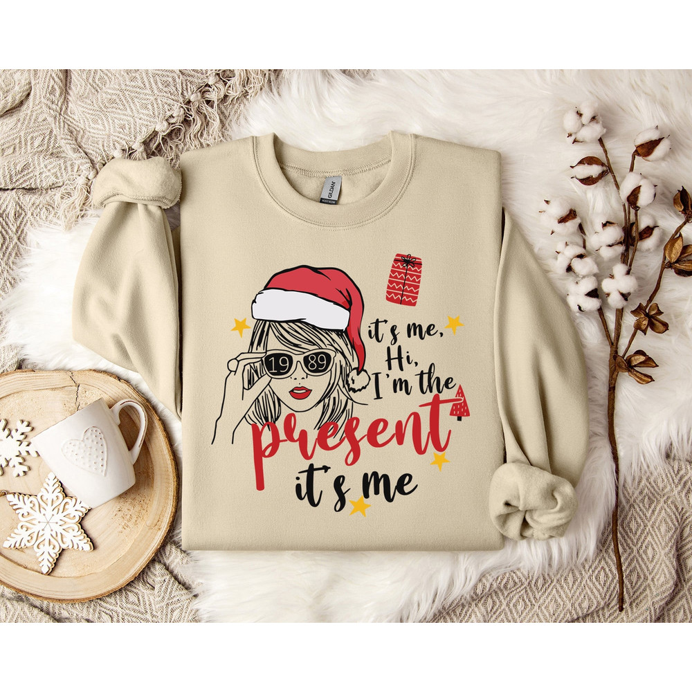 Taylor Swiftie Christmas Sweater, It's Me, Hi I'm The Present Sweatshirt, Unique Gift, Cozy Pullover, Funny Shirt, Quirky Present Design.jpg
