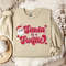 Taylor Swiftie Christmas Sweater, Santa is a Swiftie Sweatshirt, Holiday Sweater for Swifties, Festive Xmas Apparel, Sweater Party Outfit.jpg