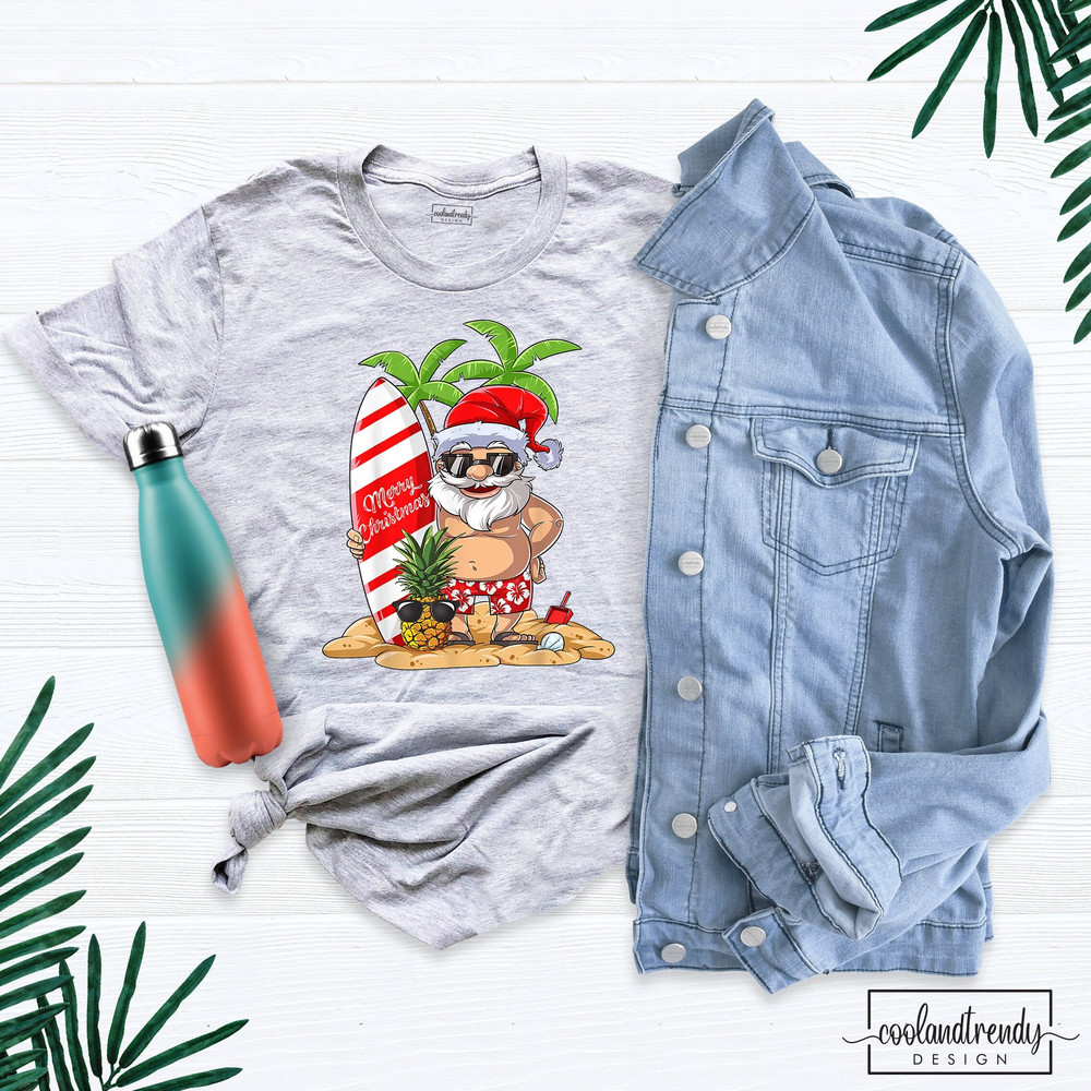 Christmas In July Shirt, Santa Surfing Shirt, Cute Santa Shirt, Christmas In July Party Shirt, Hawaiian Christmas Shirt, Santa Beach Tshirt.jpg