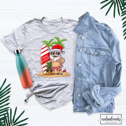 christmas in july shirt, santa surfing shirt, cute santa shirt, christmas in july party shirt, hawaiian christmas shirt,