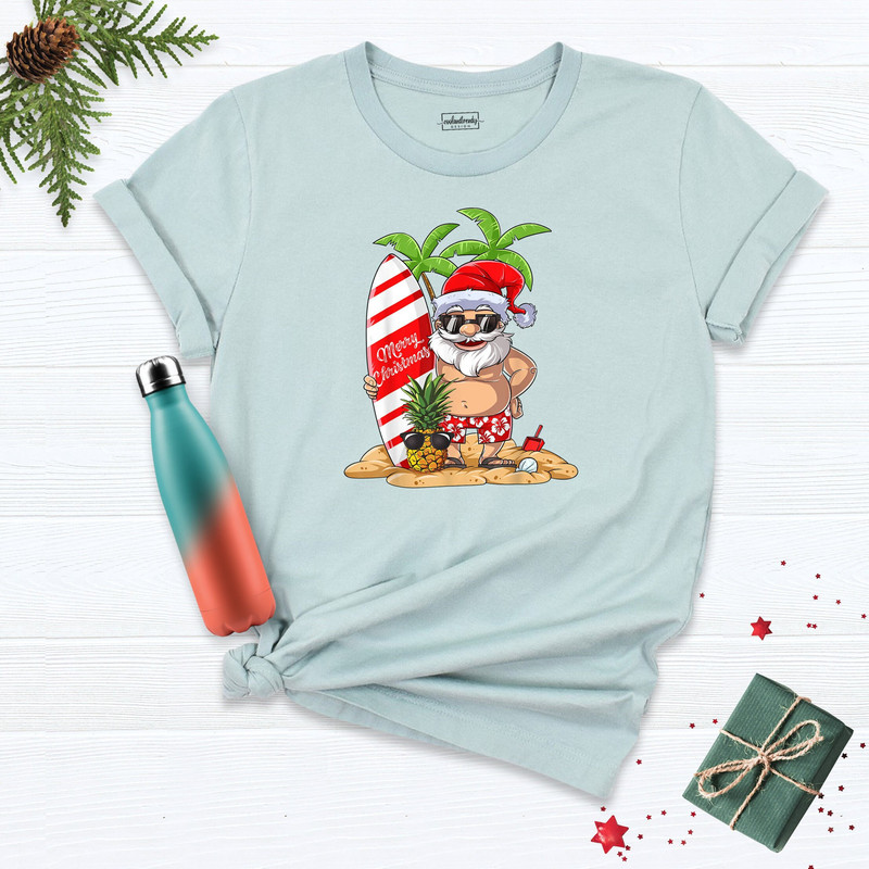Christmas Santa Kalikimaka Shirt, Hawaiian Christmas Shirt, Surfboard Christmas T-Shirt, Beach Christmas Shirt, Hawaii Matching Shirts.jpg