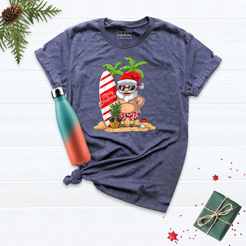 Christmas Santa Surf Shirt, Beach Christmas Tshirt, Hawaiian Christmas Shirt, Christmas On The Beach Tee, Xmas Matching Tee, Squad Goals Tee.jpg