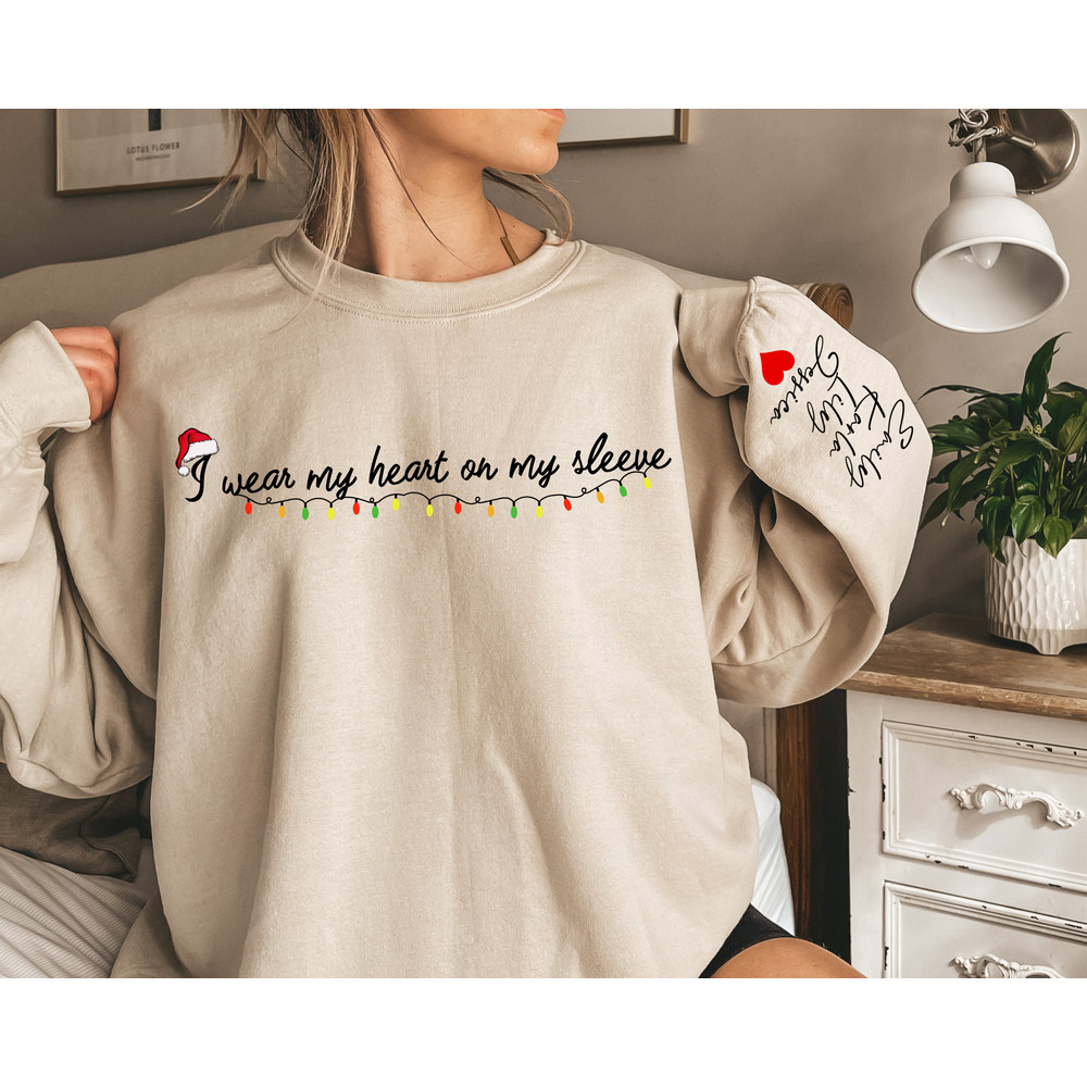 I Wear My Heart On My Sleeve Christmas Sweatshirt with Kids Names on Sleeve, New Mom Gift Personalized, Custom Gifts Mom Christmas.jpg