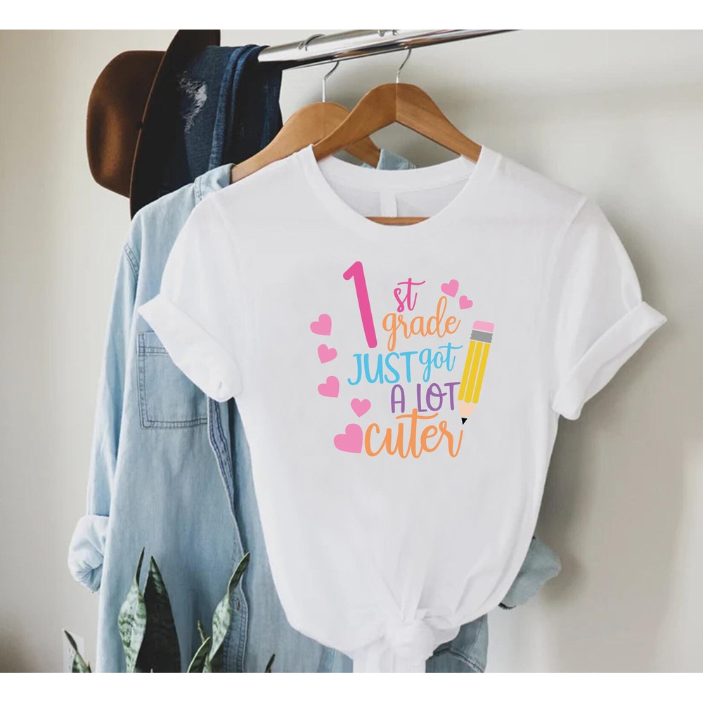 1st Grade Just Got A Lot Cuter Tshirt, First Grade Teacher Shirt, Grade Level Gift, Back To School Gift, Gift for Teacher, Women Teacher Tee.jpg