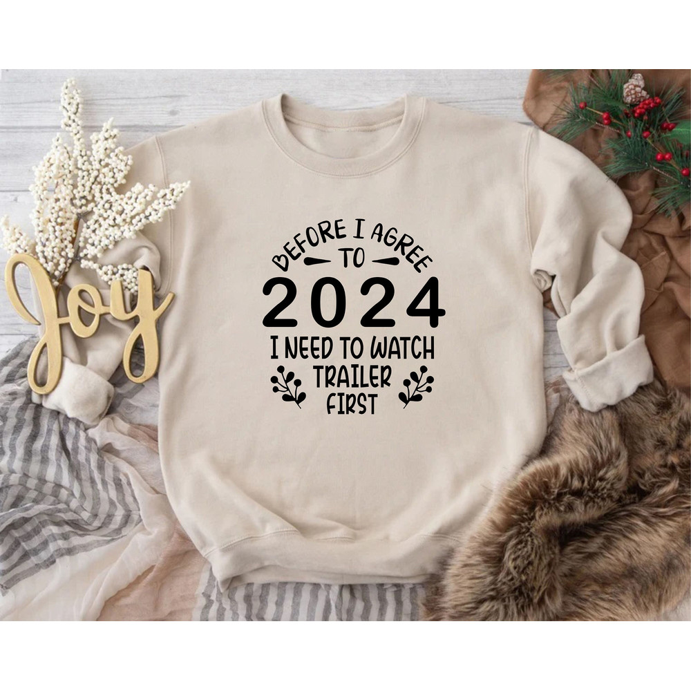 New Year Sweatshirt, Christmas Sweater, Merry Christmas Sweatshirt, Before I Agree To 2024 I Need To Watch Trailer First, Holiday Sweatshirt.jpg