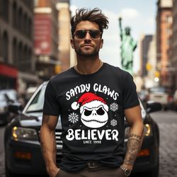 sandy claws believer inspired by nightmare before christmas jack skellington shirt, christmas vibes, disney christmas fa