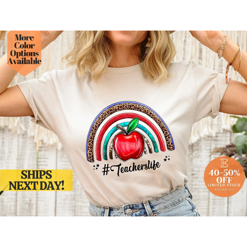 Colorful Teacher's Life T-Shirt with Rainbow and Apple Design, Bright and Cheerful Teacher Tee with Rainbow and Apple Graphic.jpg