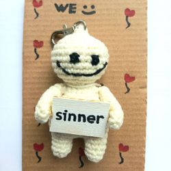 The keychain "sinner" for a bag or keys, a toy in the car interior, a pendant for the rearview mirror.