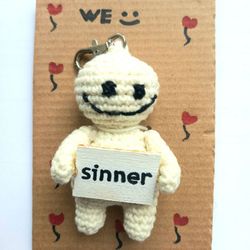 The keychain "sinner" for a bag or keys, a toy in the car interior, a pendant for the rearview mirror