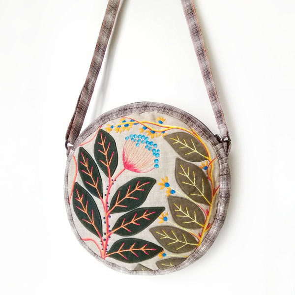 embroidered-round-canvas-crossbody-zippered-bag.jpeg