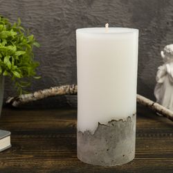 Decorative paraffin candle on concrete base