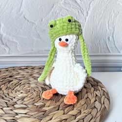 Cute goose in a frog hat. Duck keychain