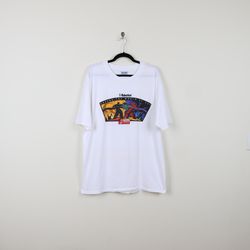 vintage y2k white us robotics around the world at 56kbps x2 modem graphic tee